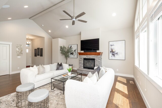 705 W Basalt Ridge Dr, Spokane, WA 99224 - living area featuring wood finished floors, high vaulted ceiling, beamed ceiling, a ceiling fan, and a fireplace