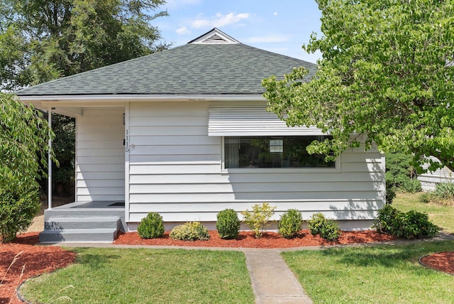 1115 E Everett Ave, Spokane, WA 99207 - view of property exterior featuring roof with shingles and a lawn
