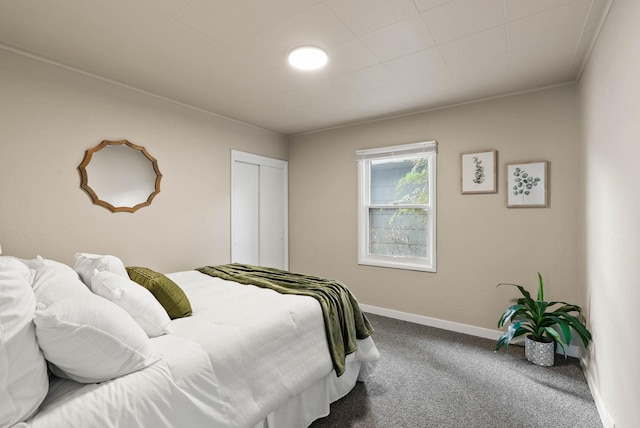 1115 E Everett Ave, Spokane, WA 99207 - carpeted bedroom featuring a closet and ornamental molding