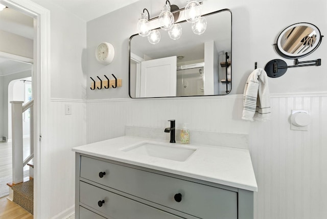 914 E 17th Ave, Spokane, WA 99203 - bathroom with a wainscoted wall, vanity, and wood finished floors