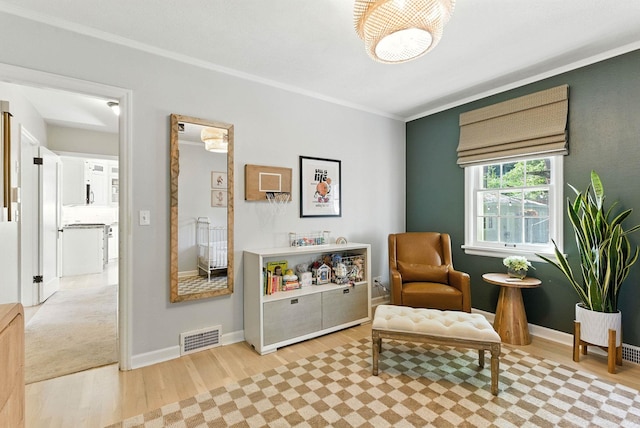 914 E 17th Ave, Spokane, WA 99203 - sitting room featuring light wood finished floors and ornamental molding