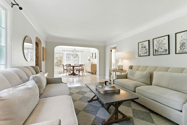914 E 17th Ave, Spokane, WA 99203 - living area featuring arched walkways, wood finished floors, and crown molding