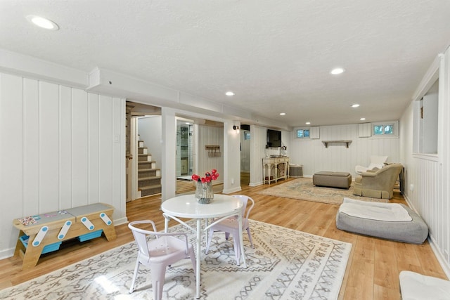 914 E 17th Ave, Spokane, WA 99203 - living room with stairway, wood finished floors, a textured ceiling, and recessed lighting