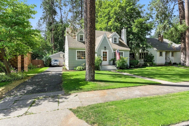 914 E 17th Ave, Spokane, WA 99203 - cape cod-style house with a front yard and a chimney