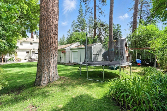914 E 17th Ave, Spokane, WA 99203 - view of green lawn with a trampoline, a playground, and a shed