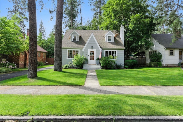 914 E 17th Ave, Spokane, WA 99203 - cape cod house featuring a chimney and a shingled roof