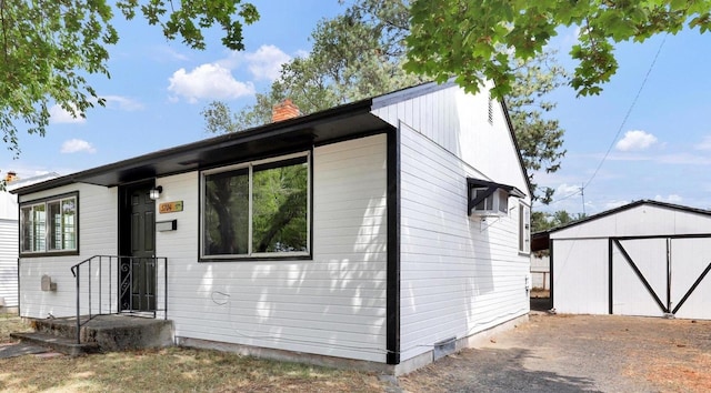 5704 N Milton St, Spokane, WA 99205 - view of front of house with an outbuilding and a chimney
