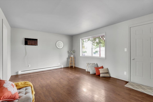 5704 N Milton St, Spokane, WA 99205 - living area featuring baseboard heating, wood finished floors, and a wall unit AC