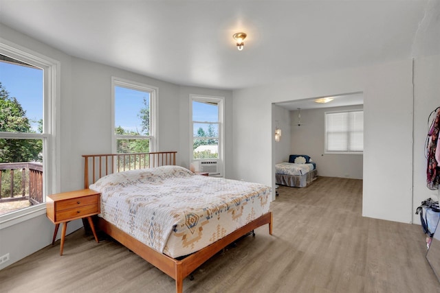 3504 W 2nd Ave, Spokane, WA 99224 - bedroom with multiple windows, light wood-type flooring, and cooling unit
