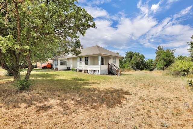 3504 W 2nd Ave, Spokane, WA 99224 - back of house featuring a lawn and covered porch