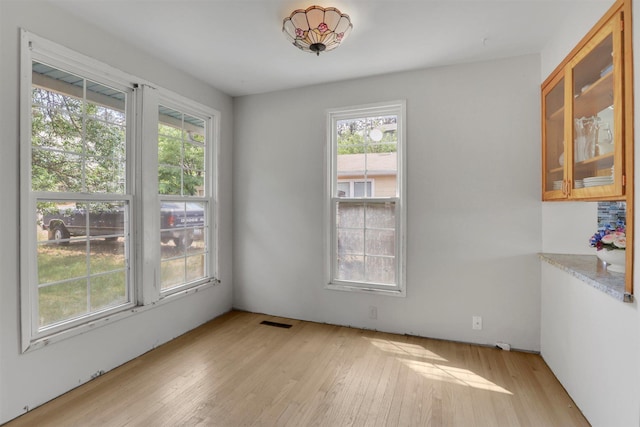 3504 W 2nd Ave, Spokane, WA 99224 - unfurnished dining area with light wood-style flooring and healthy amount of natural light