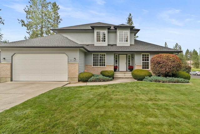 14 W Elcliff Ave, Spokane, WA 99218 - view of front facade featuring brick siding, an attached garage, a front lawn, driveway, and a shingled roof