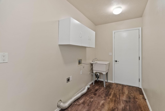 14 W Elcliff Ave, Spokane, WA 99218 - laundry area with cabinet space, electric dryer hookup, hookup for a washing machine, and dark wood-style floors