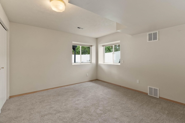 14 W Elcliff Ave, Spokane, WA 99218 - carpeted empty room with baseboards