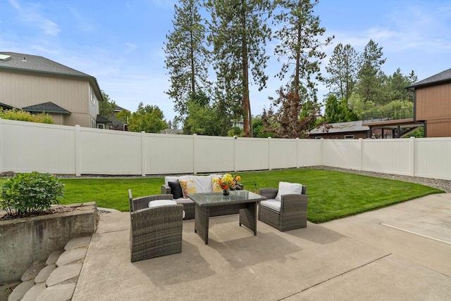14 W Elcliff Ave, Spokane, WA 99218 - fenced backyard featuring a patio and an outdoor living space
