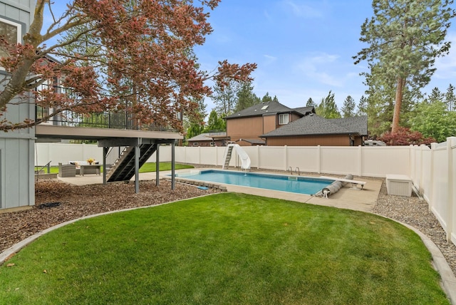 14 W Elcliff Ave, Spokane, WA 99218 - view of swimming pool with stairs, a fenced backyard, a water slide, a patio, and a wooden deck