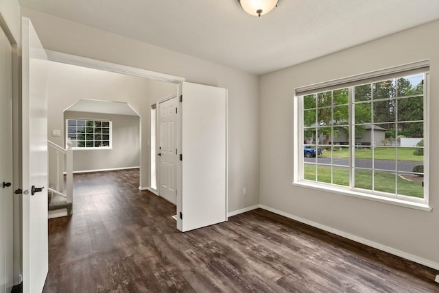 14 W Elcliff Ave, Spokane, WA 99218 - unfurnished room with dark wood finished floors and arched walkways
