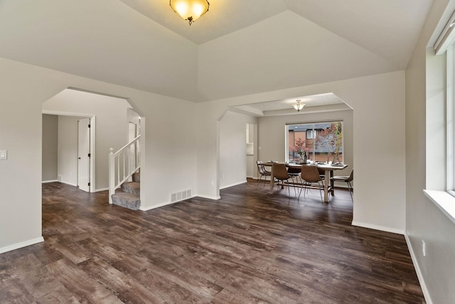 14 W Elcliff Ave, Spokane, WA 99218 - empty room featuring wood finished floors, stairs, arched walkways, and lofted ceiling