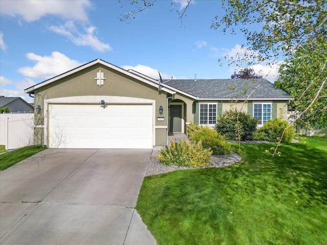 7619 S Camille Ct, Cheney, WA 99004 - ranch-style house with stucco siding, concrete driveway, and a garage