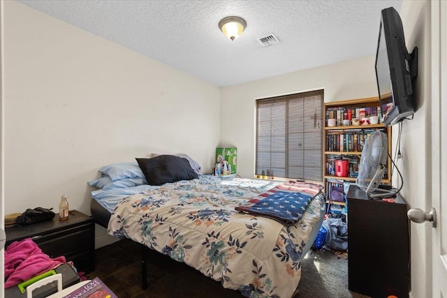 7619 S Camille Ct, Cheney, WA 99004 - carpeted bedroom with a textured ceiling