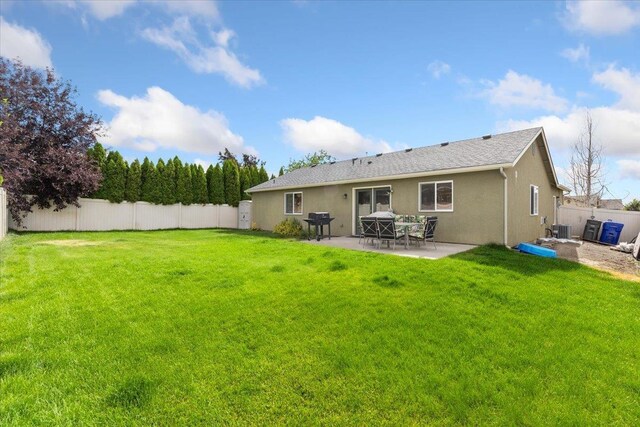 7619 S Camille Ct, Cheney, WA 99004 - back of house featuring a patio area, a fenced backyard, and stucco siding