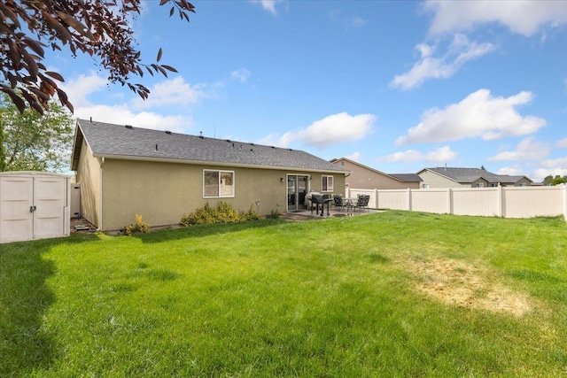 7619 S Camille Ct, Cheney, WA 99004 - back of house featuring stucco siding, a storage shed, and a patio area