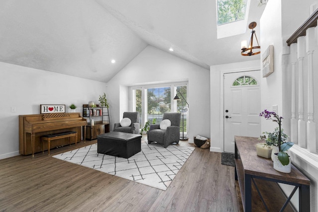 5706 W Excell Ave, Spokane, WA 99208 - living room featuring a skylight, healthy amount of natural light, light wood-type flooring, high vaulted ceiling, and recessed lighting