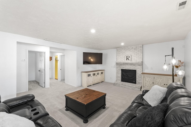 5706 W Excell Ave, Spokane, WA 99208 - living area featuring light colored carpet, a brick fireplace, and recessed lighting