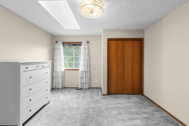 5706 W Excell Ave, Spokane, WA 99208 - bedroom with a skylight, carpet flooring, and a textured ceiling