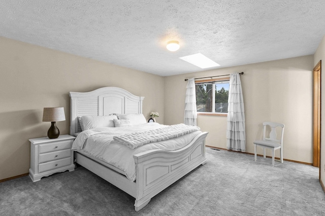 5706 W Excell Ave, Spokane, WA 99208 - carpeted bedroom featuring a skylight and a textured ceiling