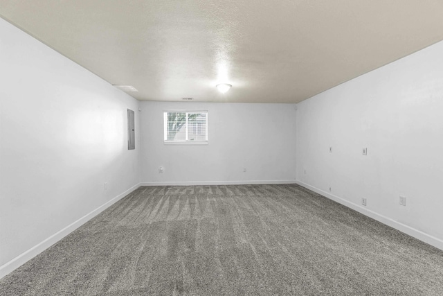 5706 W Excell Ave, Spokane, WA 99208 - carpeted spare room with electric panel and a textured ceiling