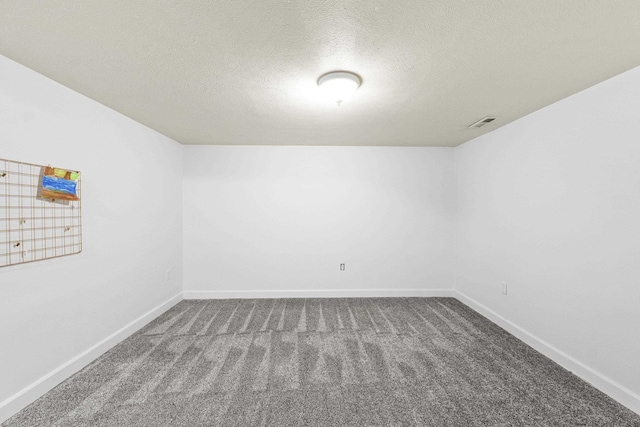5706 W Excell Ave, Spokane, WA 99208 - unfurnished room with dark colored carpet and a textured ceiling