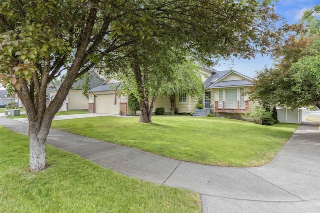 5706 W Excell Ave, Spokane, WA 99208 - view of property hidden behind natural elements with a garage, a front lawn, driveway, and brick siding