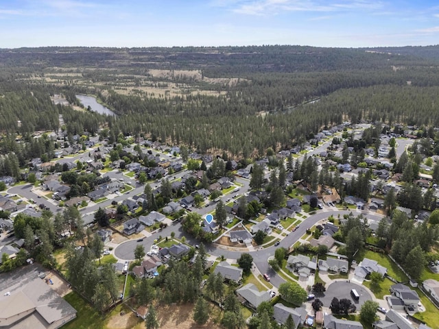 5706 W Excell Ave, Spokane, WA 99208 - aerial view of property and surrounding area featuring a heavily wooded area and nearby suburban area