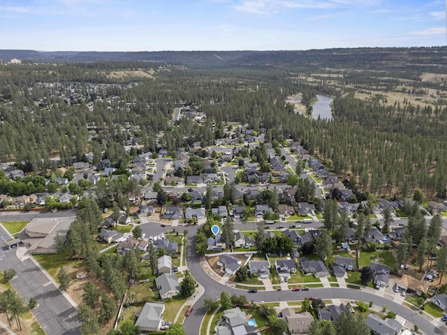 5706 W Excell Ave, Spokane, WA 99208 - aerial overview of property's location with a forest and nearby suburban area