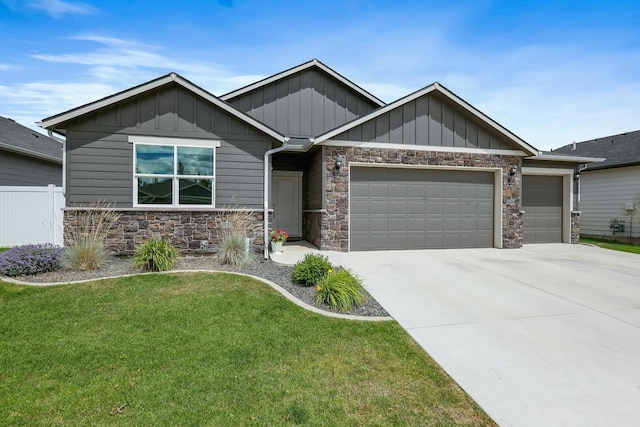 8410 W Sugar Ct, Cheney, WA 99004 - craftsman inspired home featuring stone siding, a garage, board and batten siding, and driveway