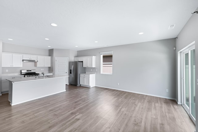 8410 W Sugar Ct, Cheney, WA 99004 - unfurnished living room featuring light wood finished floors and recessed lighting