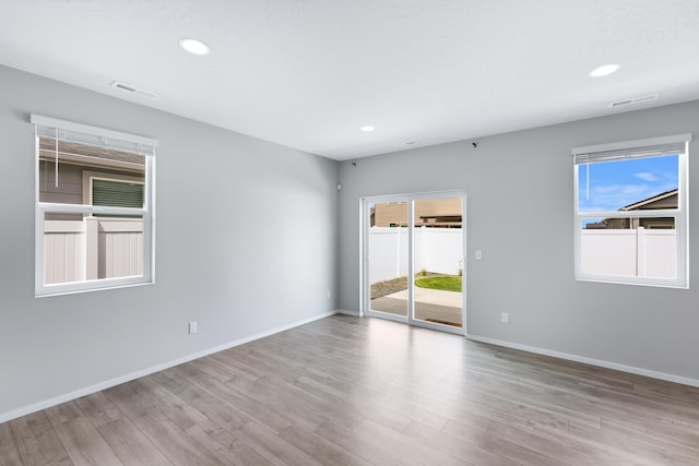 8410 W Sugar Ct, Cheney, WA 99004 - unfurnished room with healthy amount of natural light, wood finished floors, and recessed lighting