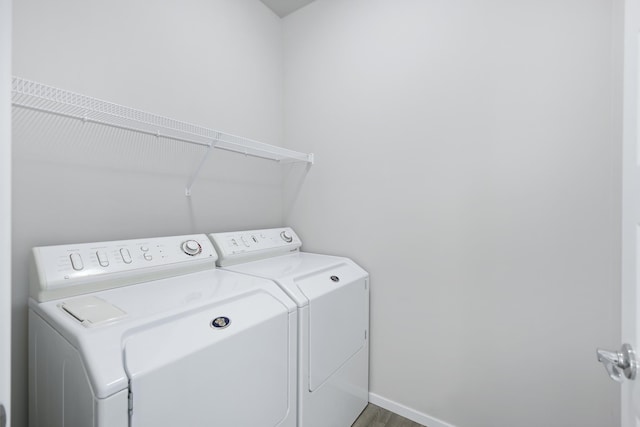 8410 W Sugar Ct, Cheney, WA 99004 - laundry room with washer and clothes dryer and wood finished floors