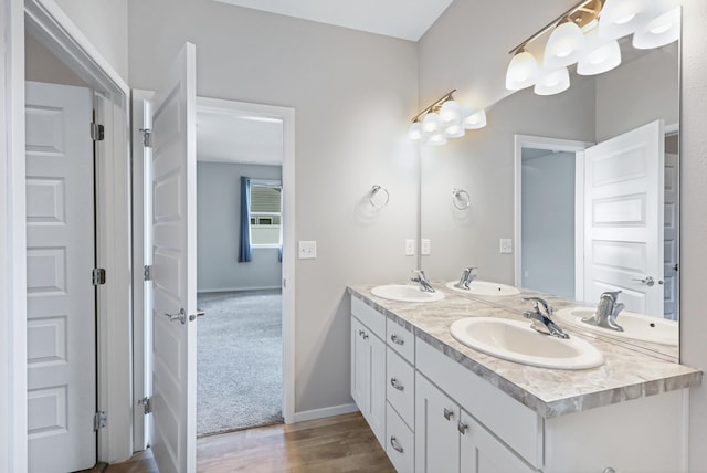 8410 W Sugar Ct, Cheney, WA 99004 - bathroom featuring double vanity and wood finished floors