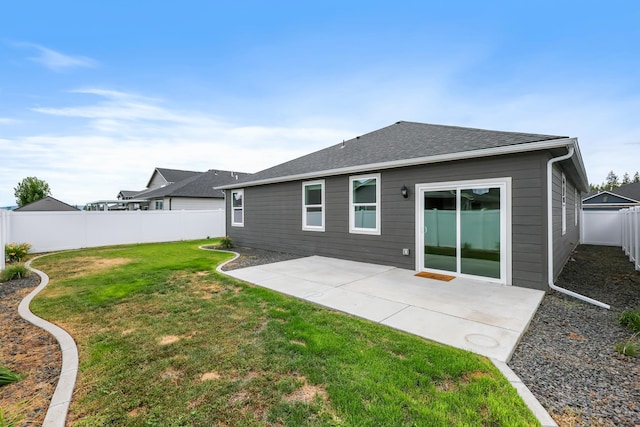 8410 W Sugar Ct, Cheney, WA 99004 - back of house featuring a fenced backyard, a patio area, and a shingled roof