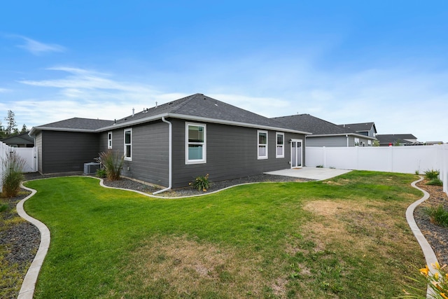 8410 W Sugar Ct, Cheney, WA 99004 - back of property with a patio, a fenced backyard, and roof with shingles