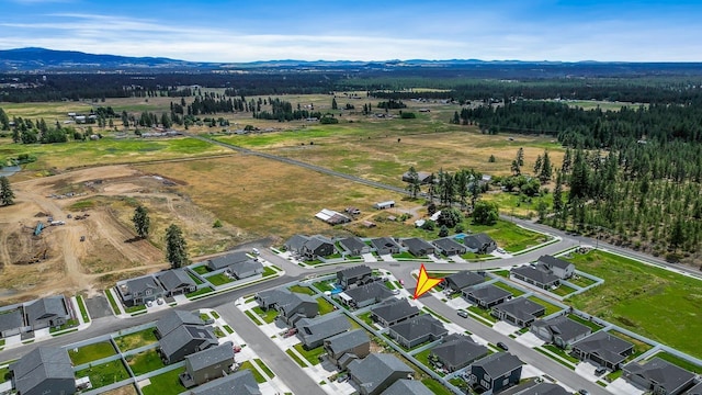 8410 W Sugar Ct, Cheney, WA 99004 - aerial overview of property's location featuring a mountain backdrop and rural landscape