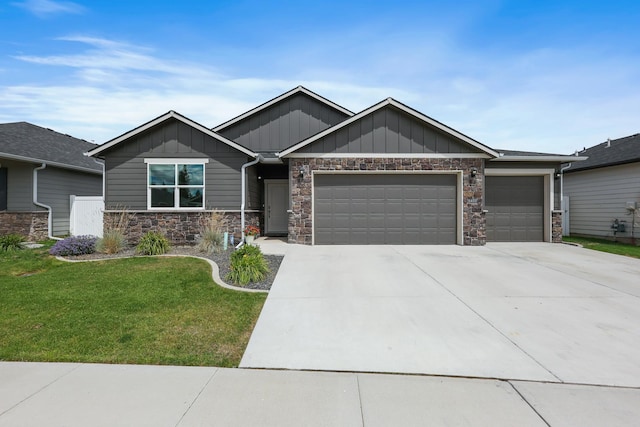 8410 W Sugar Ct, Cheney, WA 99004 - craftsman house with board and batten siding, an attached garage, driveway, a front lawn, and stone siding