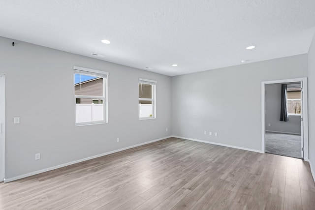 8410 W Sugar Ct, Cheney, WA 99004 - unfurnished room featuring light wood-type flooring, recessed lighting, and a textured ceiling