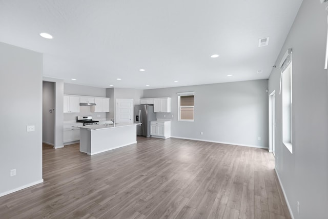 8410 W Sugar Ct, Cheney, WA 99004 - unfurnished living room featuring wood finished floors and recessed lighting