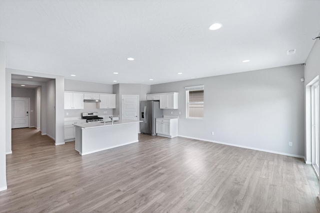 8410 W Sugar Ct, Cheney, WA 99004 - unfurnished living room featuring recessed lighting and light wood-type flooring