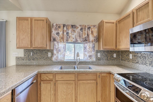 6919 N Pine Rock Pl, Spokane, WA 99208 - kitchen with stainless steel appliances, backsplash, light countertops, and light brown cabinets