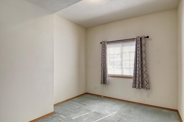 6919 N Pine Rock Pl, Spokane, WA 99208 - empty room with light colored carpet and a textured ceiling