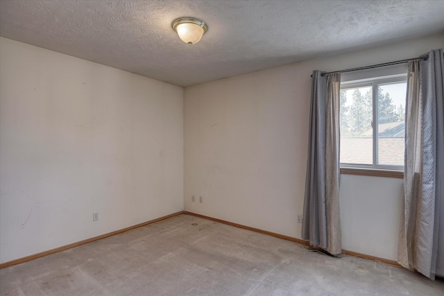 6919 N Pine Rock Pl, Spokane, WA 99208 - unfurnished room with light colored carpet and a textured ceiling